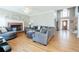 Inviting living room with fireplace, comfortable seating, and hardwood floors throughout at 1018 Jubilee Way, Powder Springs, GA 30127