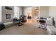 Home office space with natural light, carpet, and open access to the dining room and stairs at 1018 Jubilee Way, Powder Springs, GA 30127