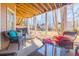 The patio has comfortable seating and has a view of the yard with playground at 1018 Jubilee Way, Powder Springs, GA 30127
