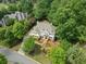 Aerial view of landscaped property with circular drive and lush green surroundings at 2616 Boddie Pl, Duluth, GA 30097