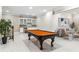 A finished basement featuring a billiards table, wet bar, and comfortable seating area at 2616 Boddie Pl, Duluth, GA 30097
