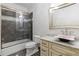 This bathroom has a tile surround, a glass shower door, a vanity and a uniquely shaped sink at 2616 Boddie Pl, Duluth, GA 30097