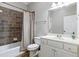 Traditional bathroom has a vanity with sink, toilet, tub and shower with neutral tile surround at 2616 Boddie Pl, Duluth, GA 30097