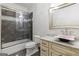 A well-lit bathroom with a shower and custom vanity featuring a pink vessel sink at 2616 Boddie Pl, Duluth, GA 30097