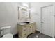 Elegant bathroom featuring a unique pink sink, marble countertop, and modern lighting fixtures at 2616 Boddie Pl, Duluth, GA 30097