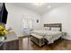 Bright bedroom with hardwood floors and walkout to a private balcony, offering a peaceful retreat at 2616 Boddie Pl, Duluth, GA 30097