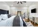 Modern bedroom boasts a plush bed, French doors to a balcony, and ample natural light at 2616 Boddie Pl, Duluth, GA 30097