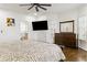 Spacious bedroom with natural light, zebra patterned bedding, and a mounted television on the wall at 2616 Boddie Pl, Duluth, GA 30097