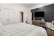 Modern bedroom features sleek wall design and hardwood flooring, creating a stylish sleeping space at 2616 Boddie Pl, Duluth, GA 30097