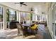 Spacious covered patio with outdoor kitchen, dining area, and lounge seating for relaxing or entertaining while enjoying scenic views at 2616 Boddie Pl, Duluth, GA 30097