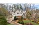 Attractive two-story home boasting mature trees, a winding driveway, and meticulously maintained landscaping at 2616 Boddie Pl, Duluth, GA 30097