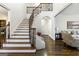 Elegant foyer features hardwood floors, a curved staircase with iron railing, and an open floor plan at 2616 Boddie Pl, Duluth, GA 30097