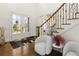 Grand foyer boasting hardwood floors, a staircase with iron railing, and a stylish front door at 2616 Boddie Pl, Duluth, GA 30097