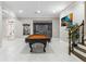 Bright game room boasts a billiard table, stairs to the upper level, and neutral decor at 2616 Boddie Pl, Duluth, GA 30097