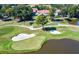 Picturesque golf course view featuring lush greens, sand traps, and a serene pond, perfect for golf enthusiasts at 2616 Boddie Pl, Duluth, GA 30097