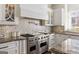 Gourmet kitchen with high-end appliances, custom cabinetry, and granite counters for the avid cook at 2616 Boddie Pl, Duluth, GA 30097