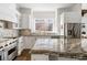 Spacious kitchen with granite countertops, stainless steel appliances, and ample cabinet space at 2616 Boddie Pl, Duluth, GA 30097
