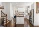 Modern kitchen with stainless steel appliances, granite countertops, and an island with bar seating at 2616 Boddie Pl, Duluth, GA 30097
