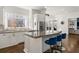Gourmet kitchen with breakfast bar, large window, stainless appliances, and hardwood flooring at 2616 Boddie Pl, Duluth, GA 30097