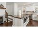 Spacious kitchen island with stainless steel appliances and white cabinetry, perfect for modern living at 2616 Boddie Pl, Duluth, GA 30097