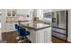 Beautiful kitchen featuring a stainless steel refrigerator and a large kitchen island with seating at 2616 Boddie Pl, Duluth, GA 30097
