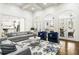 Open concept living room boasts high ceilings, arched windows and plenty of natural light at 2616 Boddie Pl, Duluth, GA 30097
