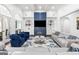 Elegant living area with blue accent wall, built-in shelves, and a cozy seating arrangement at 2616 Boddie Pl, Duluth, GA 30097