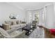 Bright living room with large windows, neutral tones, and cozy seating area perfect for relaxation at 2616 Boddie Pl, Duluth, GA 30097