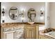 Custom cabinets, dual sinks, marble countertops, and custom lighting in this main bathroom at 2616 Boddie Pl, Duluth, GA 30097