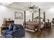 Spacious main bedroom features a ceiling fan, four-poster bed, and comfortable seating area at 2616 Boddie Pl, Duluth, GA 30097