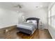 A primary bedroom offers natural light, hardwood floors, and a decorative gray bed frame at 2616 Boddie Pl, Duluth, GA 30097