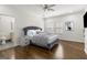 A primary bedroom boasts a luxurious gray bed frame, hardwood floors, and abundant natural light at 2616 Boddie Pl, Duluth, GA 30097