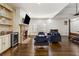 Large main bedroom features a stone fireplace, built-in bar, and hardwood floors, providing a luxurious retreat at 2616 Boddie Pl, Duluth, GA 30097