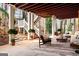Covered outdoor patio with wood ceiling, decorative furniture and scenic views at 2616 Boddie Pl, Duluth, GA 30097