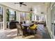 Spacious screened-in porch featuring an outdoor kitchen, dining area, and lounge space for entertaining at 2616 Boddie Pl, Duluth, GA 30097