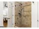 A shower with a frameless glass door and custom tile work at 2616 Boddie Pl, Duluth, GA 30097