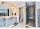 Modern bathroom with double vanity, separate toilet room and glass shower with subway tile at 2686 Oak Leaf Se Pl, Atlanta, GA 30316