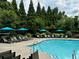 Community pool with lounge chairs and umbrellas, perfect for relaxing on a summer day at 2686 Oak Leaf Se Pl, Atlanta, GA 30316