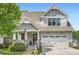 Charming two-story home boasts inviting curb appeal and a well-maintained front yard and attached garage at 2686 Oak Leaf Se Pl, Atlanta, GA 30316