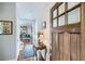 Bright foyer with hardwood floors, fresh paint, and an inviting view into the modern kitchen at 2686 Oak Leaf Se Pl, Atlanta, GA 30316