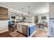 Open-concept kitchen features granite countertops, and flows seamlessly into dining and living areas at 2686 Oak Leaf Se Pl, Atlanta, GA 30316