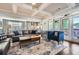 Open concept living room adjacent to the kitchen with hardwood floors and access to the outdoor living at 2686 Oak Leaf Se Pl, Atlanta, GA 30316
