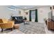 Cozy living room featuring a comfortable couch, stylish rug, and natural light from the window at 2686 Oak Leaf Se Pl, Atlanta, GA 30316