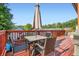 Multi-level deck with dining set, umbrella, and open view at 2686 Oak Leaf Se Pl, Atlanta, GA 30316