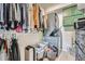 Organized walk-in closet with clothing racks, shelving, and in-unit washer and dryer at 2686 Oak Leaf Se Pl, Atlanta, GA 30316