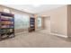 Bonus room with built-in bookshelves, carpet floors, and a large window for ample natural light at 4616 Town Manor Dr, Douglasville, GA 30135