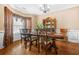 Formal dining room with hardwood floors, elegant furnishings, and a chandelier at 4616 Town Manor Dr, Douglasville, GA 30135