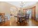 Dining room with hardwood floors, ample seating, and elegant decor at 4616 Town Manor Dr, Douglasville, GA 30135