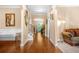 Elegant foyer with gleaming hardwood floors, staircase, and decorative accents at 4616 Town Manor Dr, Douglasville, GA 30135