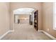 Second floor hallway featuring built-in bookshelves and arched passageway to another room at 4616 Town Manor Dr, Douglasville, GA 30135